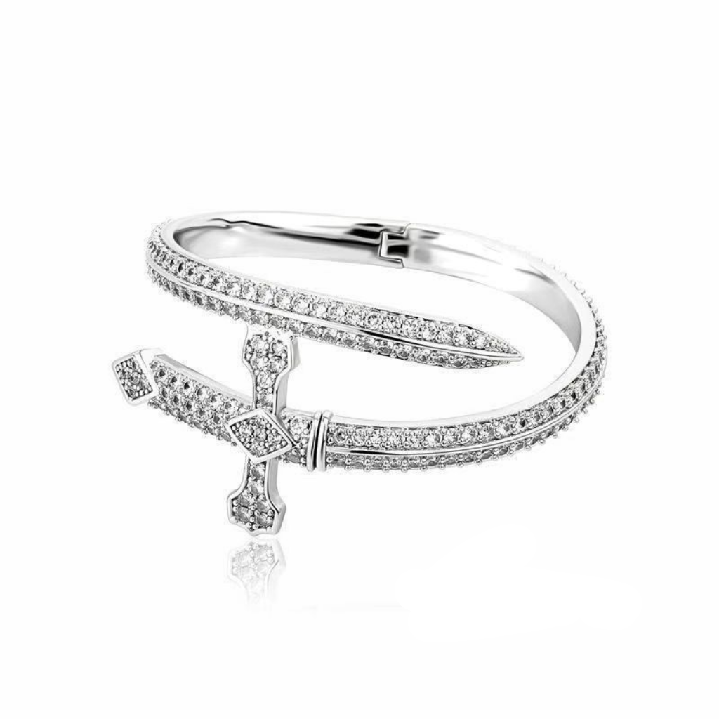 Silver bracelet with cross charm on a white background, featuring 'Guided by Cross' logo.