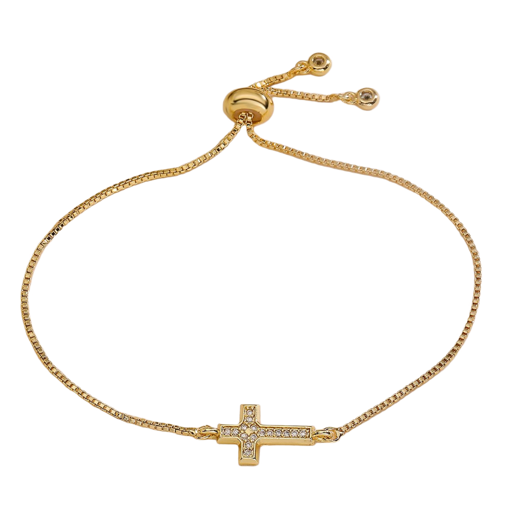 Gold bracelet with a cross charm on a white background, featuring the brand 'Guided by Cross'.