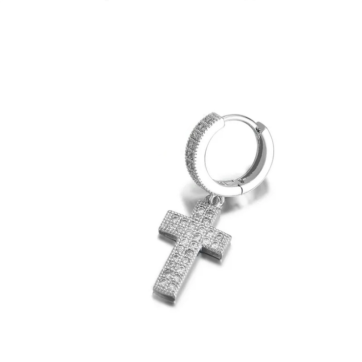 Gold and silver hoop earrings with cross pendants on a white background