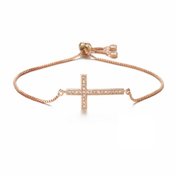 Rose gold bracelet with a cross charm on a white background, featuring 'Guided by Cross' branding.