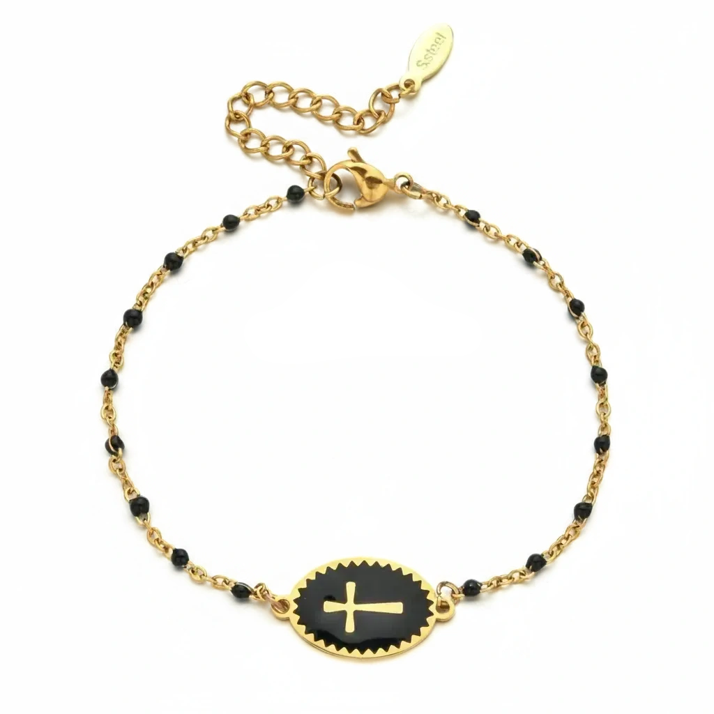 Gold bracelet with black beads and a gold cross on a white background