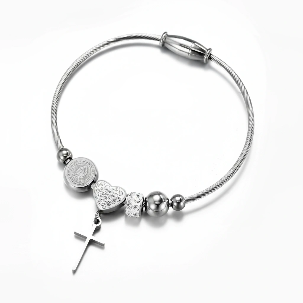 Silver bracelet with heart and cross charms on a white background, featuring 'Guided by Cross' branding.