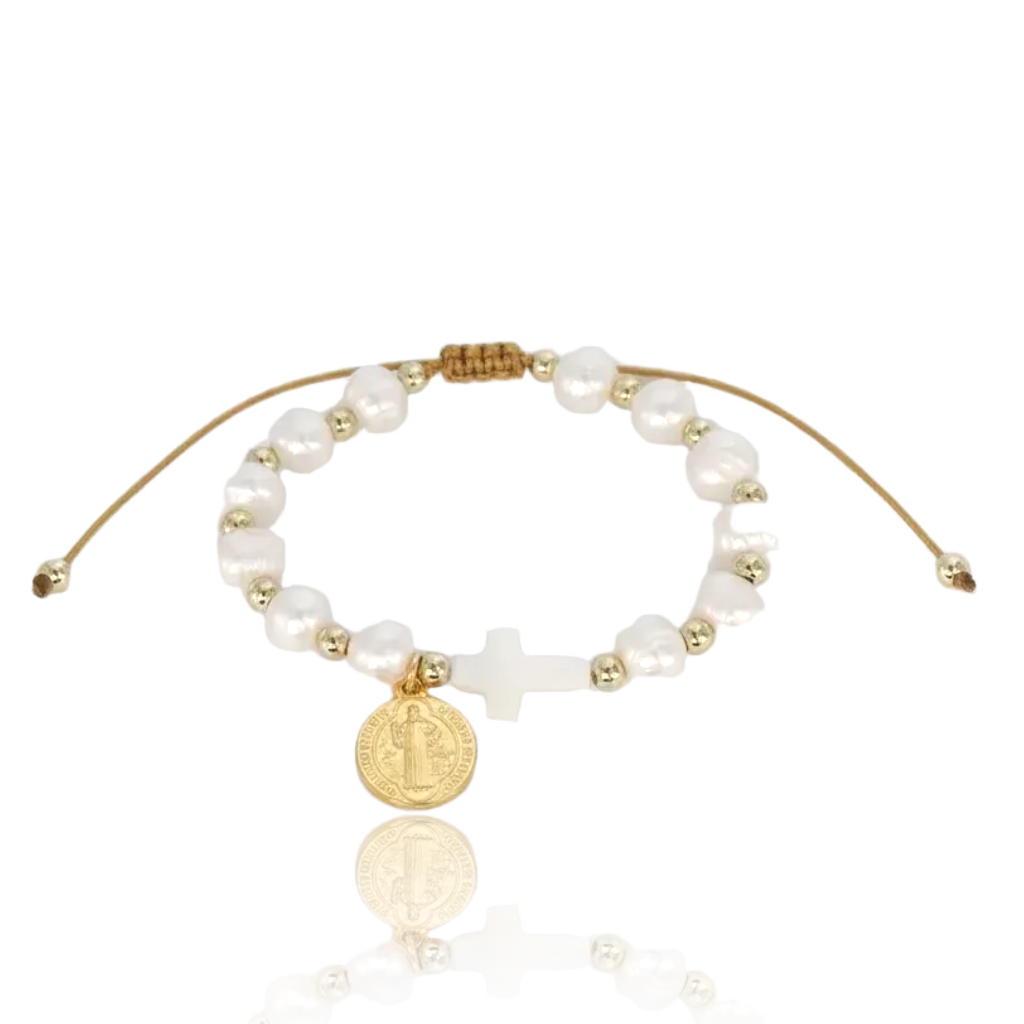 Bracelet with pearls and gold accents on a white background, featuring 'Guided by Cross' branding.