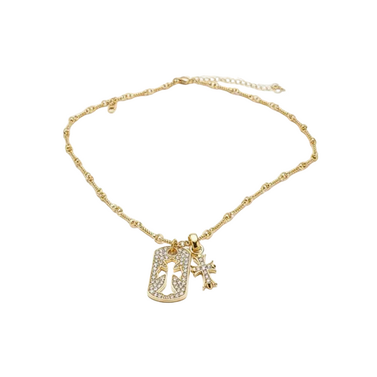 Gold necklace with a pendant and cross charm on a white background, branded 'Guided by Cross'.