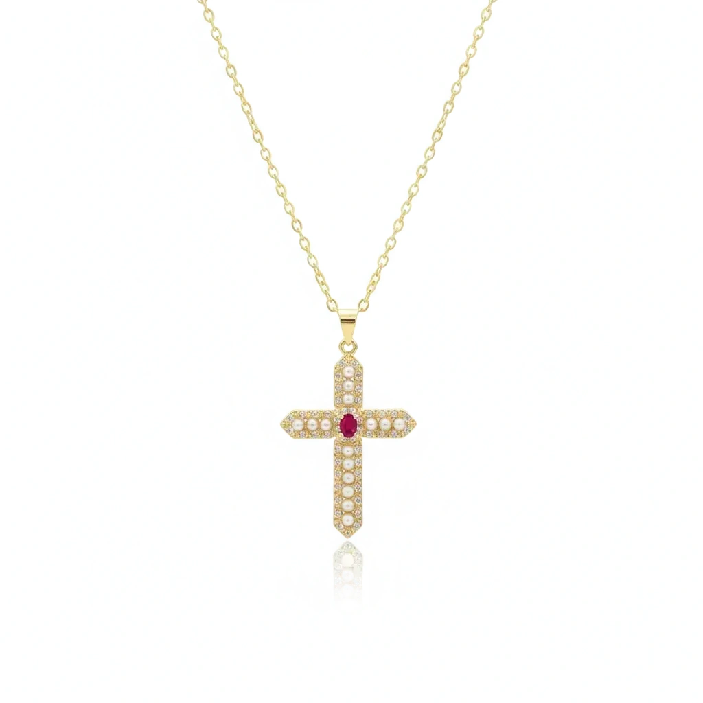 Gold cross necklace with a red gemstone on a white background, branded 'Guided by Cross'.