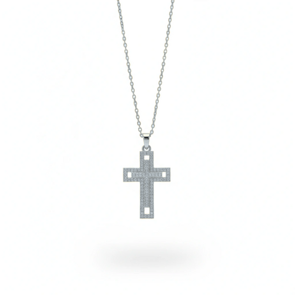 Silver cross pendant necklace on a white background