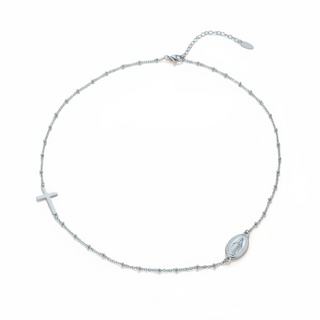 Silver necklace with cross and maria形象 pendant on a white background, brand 'Guided by Cross' visible.