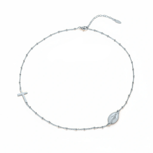Silver necklace with cross and maria形象 pendant on a white background, brand 'Guided by Cross' visible.
