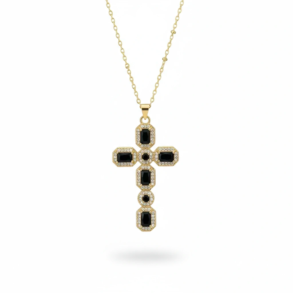 Gold necklace with a black cross pendant on a white background