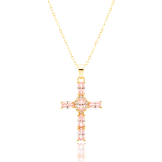 Gold cross necklace with pink gemstones on a white background, featuring 'Guided by Cross' branding.